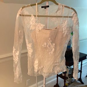 Nude undergarment with netted shirt with butterflies embroidered on it. Midriff